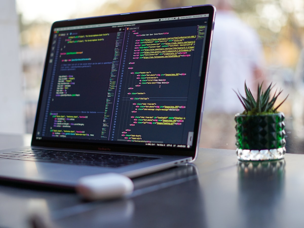 AI chatbot interface code on a laptop — MindForge Labs AI training